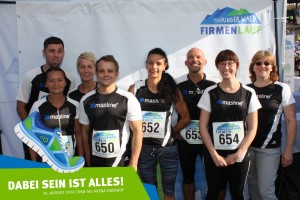 Teilnehmer vom Team Masline vor der Fotowand beim Thüringer Wald Firmenlauf 2016 in der DKB-Ski-Arena Oberhof